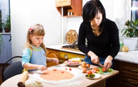 Mom and daughter cooking and relaxing.