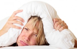 Woman cannot sleep because of insomnia.