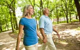 Mature couple walking in the park for exercise.