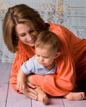 Shannon hugging Rocco on the floor.