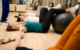 Friends exercising at Pilates class.