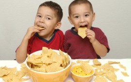 Little boys eating calcium rich queso