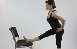 Shannon Miller stretching with chair