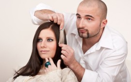 Professional hairdresser choose hair dye color at salon